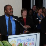 Former foster child Mez Pierre addresses attendees at the recent Florida's Children First event.