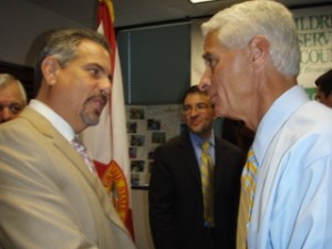 Child advocate attorney Howard Talenfeld greets Florida Gov. Charlie Crist at the historic signing ceremony.